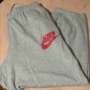 Nike Kids Gray Joggers with Red Swoosh